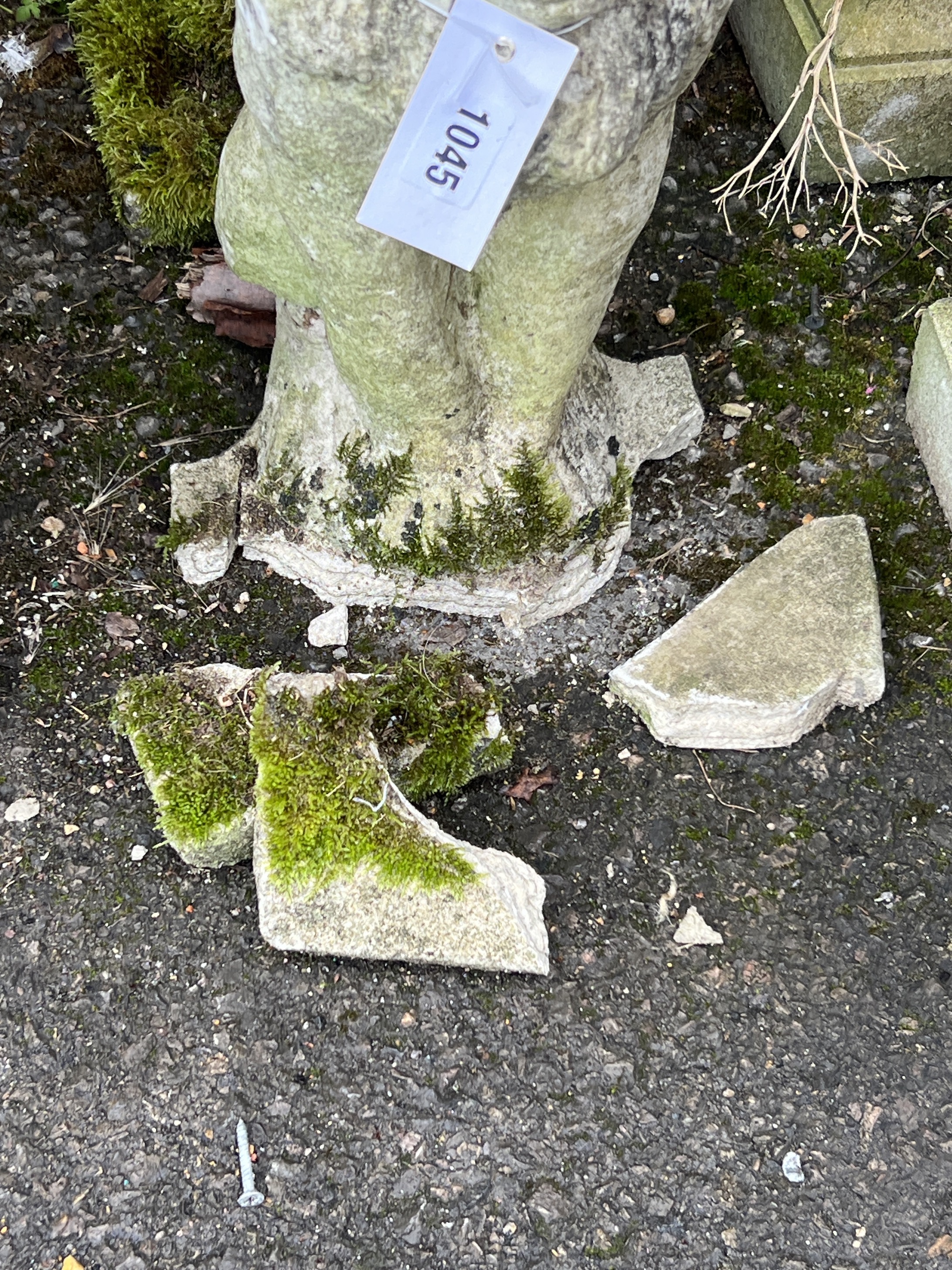 A pair of reconstituted stone seated lion garden ornaments, height 52cm